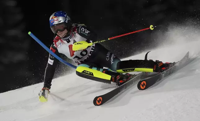 Albania's Lara Colturi speeds down the course during an alpine ski, women's World Cup slalom in Flachau, Austria, Tuesday, Jan.14, 2025. (AP Photo/Giovanni Auletta)