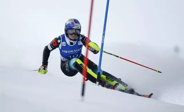 Albania's Lara Colturi speeds down the course during a women's World Cup slalom, in Courchevel, France, Thursday Jan. 30, 2025. (AP Photo/Gabriele Facciotti)