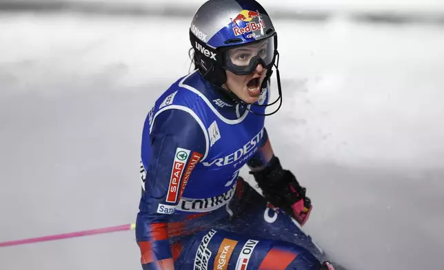 Croatia's Zrinka Ljutic celebrates in the finish area after winning a women's World Cup slalom, in Courchevel, France, Thursday Jan. 30, 2025. (AP Photo/Gabriele Facciotti)