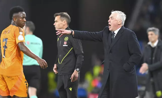 Real Madrid's head coach Carlo Ancelotti gives instructions from the side line during the Spanish Copa del Rey soccer match between Real Sociedad and Real Madrid at the Reale Arena in San Sebastian, Spain, Wednesday, Feb. 26, 2025. (AP Photo/Miguel Oses)