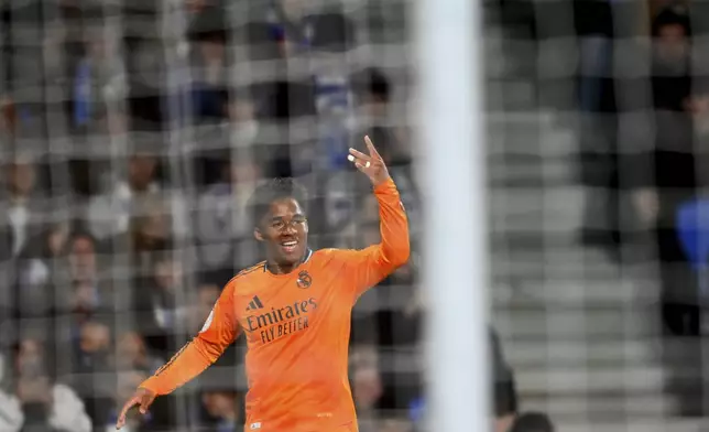 Real Madrid's Endrick celebrates after scoring his side's opening goal during the Spanish Copa del Rey soccer match between Real Sociedad and Real Madrid at the Reale Arena in San Sebastian, Spain, Wednesday, Feb. 26, 2025. (AP Photo/Miguel Oses)