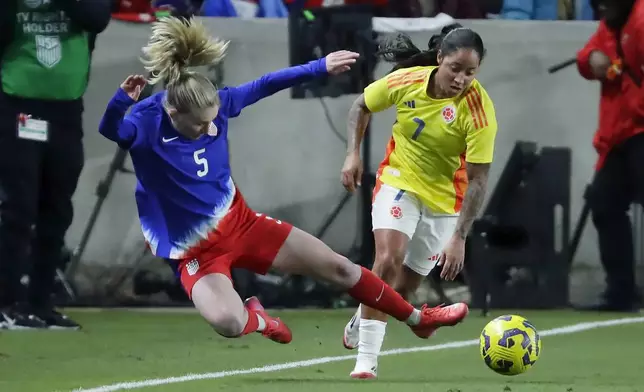 United States defender Jenna Nighswonger (5) keeps the ball in-bounds in front of Colombia forward Manuela Pavi (7) during the SheBelieves Cup women's soccer tournament, Thursday, Feb. 20, 2025, in Houston. (AP Photo/Michael Wyke)