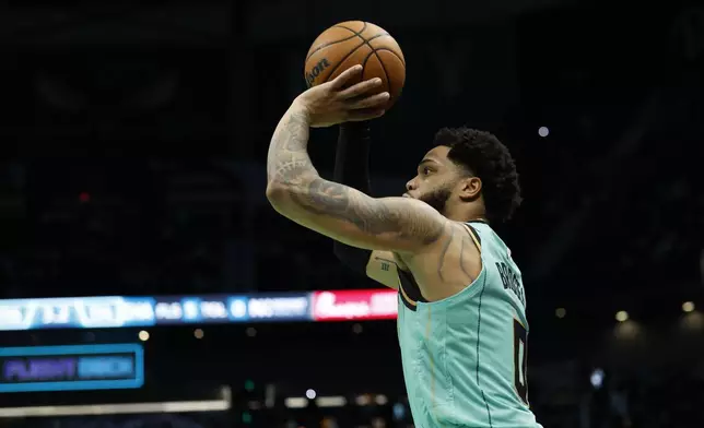 Charlotte Hornets forward Miles Bridges prepares to shoot the winning 3-point basket during the second half of an NBA basketball game against the San Antonio Spurs in Charlotte, N.C., Friday, Feb. 7, 2025. (AP Photo/Nell Redmond)
