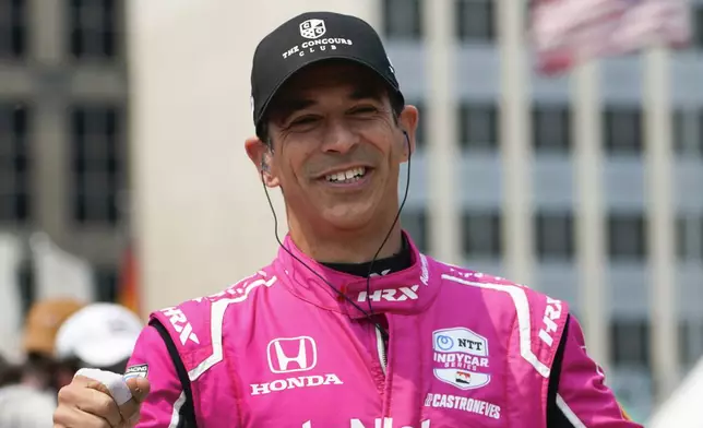 FILE - Helio Castroneves is introduced before the IndyCar Detroit Grand Prix auto race in Detroit, June 4, 2023. (AP Photo/Paul Sancya, file)
