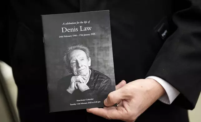 A view of the order of service at Manchester Cathedral for the funeral of former Manchester United, Manchester City and Scotland forward Denis Law, in Manchester, England, Tuesday, Feb. 11, 2025. (Martin Rickett/PA via AP)
