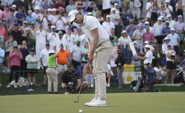 Thomas Detry, of Belgium, makes his birdie putt on the 18th hole to win the Phoenix Open golf tournament at TPC Scottsdale, Sunday, Feb. 9, 2025, in Scottsdale, Ariz. (AP Photo/Ross D. Franklin)