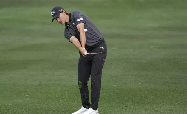 Rasmus Højgaard, of Denmark, hits his approach shot at the second hole during the final round of the Phoenix Open golf tournament at TPC Scottsdale Sunday, Feb. 9, 2025, in Scottsdale, Ariz. (AP Photo/Ross D. Franklin)