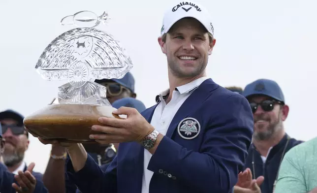 Thomas Detry, of Belgium, celebrates after winning the Phoenix Open golf tournament at TPC Scottsdale, Sunday, Feb. 9, 2025, in Scottsdale, Ariz. (AP Photo/Ross D. Franklin)