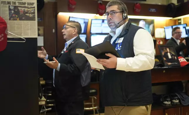 Traders work on the floor at the New York Stock Exchange in New York, Monday, Feb. 3, 2025. (AP Photo/Seth Wenig)