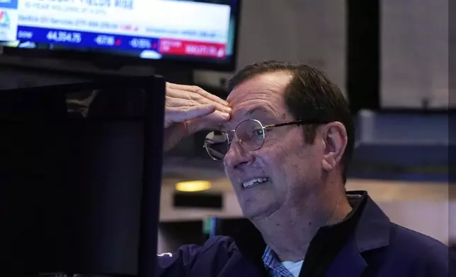 Trader William O'Keefe works on the floor of the New York Stock Exchange, Tuesday, Feb. 4, 2025. (AP Photo/Richard Drew)