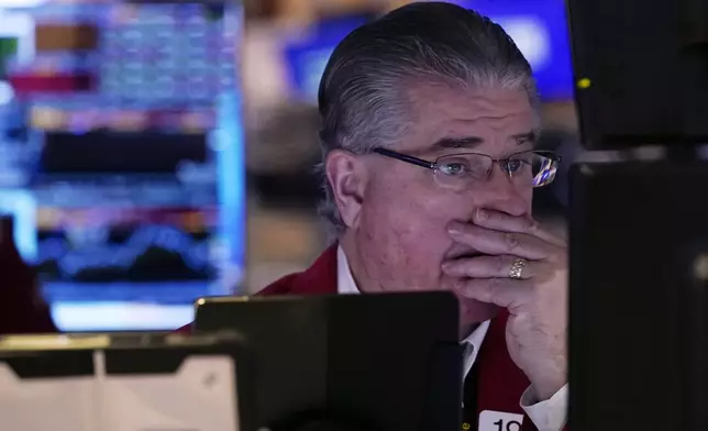 Trader Daniel Kryger works on the floor of the New York Stock Exchange, Tuesday, Feb. 4, 2025. (AP Photo/Richard Drew)
