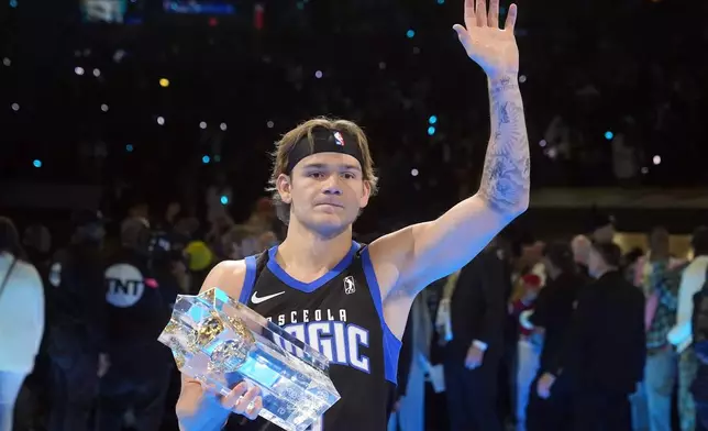 FILE - Osceola Magic's Mac McClung waves after winning the slam dunk competition at the NBA basketball All-Star weekend, Saturday, Feb. 17, 2024, in Indianapolis. (AP Photo/Darron Cummings)