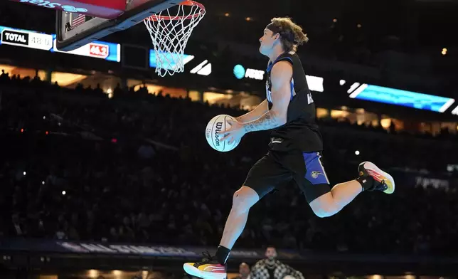 FILE - Osceola Magic's Mac McClung dunks during the slam dunk competition at the NBA basketball All-Star weekend, Saturday, Feb. 17, 2024, in Indianapolis. (AP Photo/Darron Cummings, File)