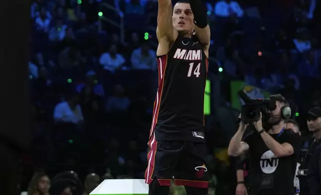 Miami Heat guard Tyler Herro shoots during the 3-point contest at the NBA basketball All-Star Saturday night festivities Saturday, Feb. 15, 2025, in San Francisco. (AP Photo/Godofredo A. Vásquez)