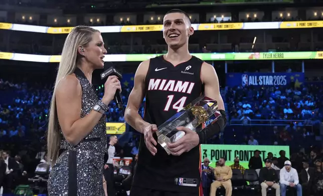Miami Heat guard Tyler Herro is interviewed by Allie LaForce after winning the 3-point contest at the NBA basketball All-Star Saturday night festivities Saturday, Feb. 15, 2025, in San Francisco. (AP Photo/Godofredo A. Vásquez)
