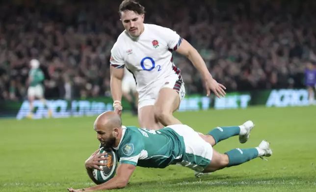 Ireland's Jamison Gibson-Park scores his side's first try during the Six Nations rugby union match between Ireland and England at the Aviva Stadium in Dublin, Saturday, Feb. 1, 2025. (AP Photo/Peter Morrison)