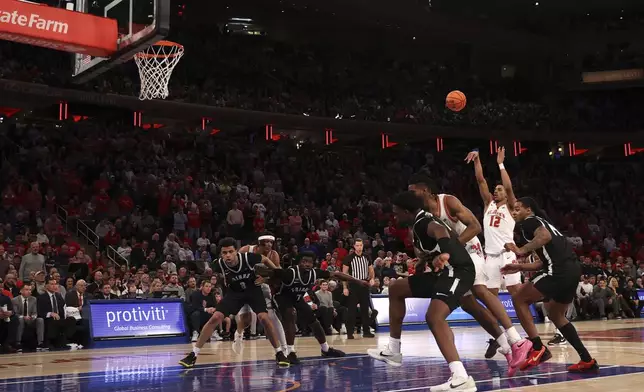 St. John's guard RJ Luis Jr. (12) shoots a free throw during the second half of an NCAA college basketball game against Providence Saturday, Feb. 1, 2025, in New York. (AP Photo/Pamela Smith)