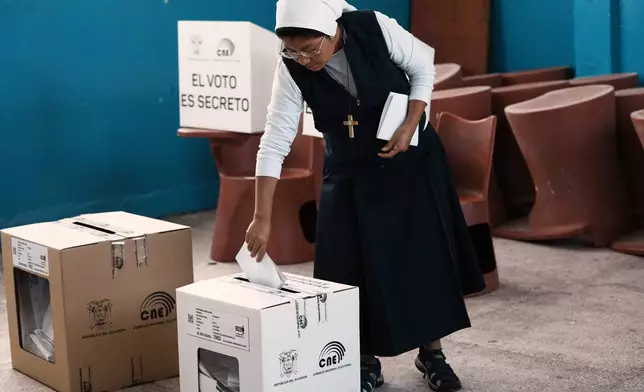 A nun votes during presidential elections in Quito, Ecuador, Sunday, Feb. 9, 2025. (AP Photo/Dolores Ochoa)