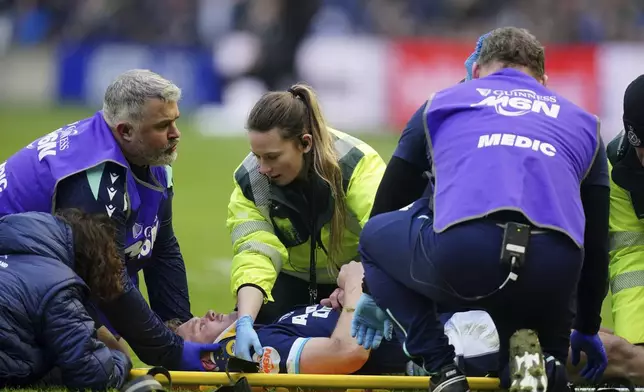 Scotland's Darcy Graham is stretchered off during the Six Nations match between Scotland and Ireland at Murrayfield Stadium, Edinburgh, Sunday Feb. 9, 2025. (Jane Barlow/PA via AP)