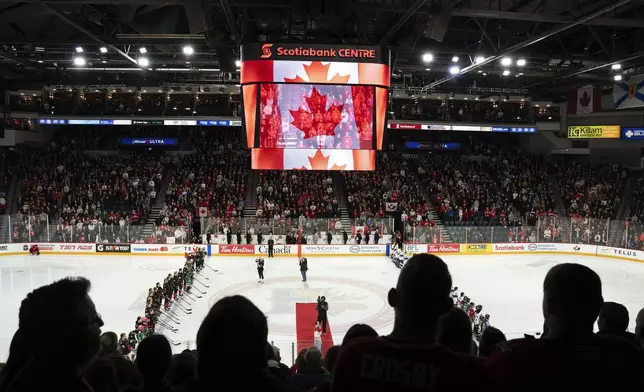 Fans stand for Canada's national anthem before a women's Rivalry Series hockey game against the United States in Halifax, Nova Scotia, Thursday, Feb. 6, 2025. (Darren Calabrese/The Canadian Press via AP)