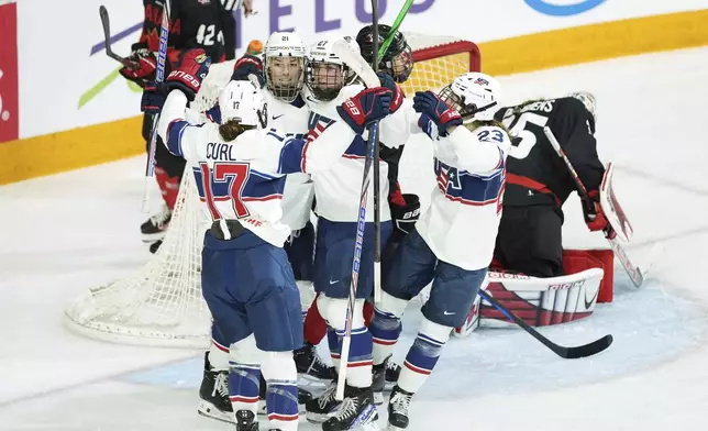 United States players celebrate after Hilary Knight's first-period goal against Canada during a women's Rivalry Series hockey game in Halifax, Nova Scotia, Thursday, Feb. 6, 2025. (Darren Calabrese/The Canadian Press via AP)