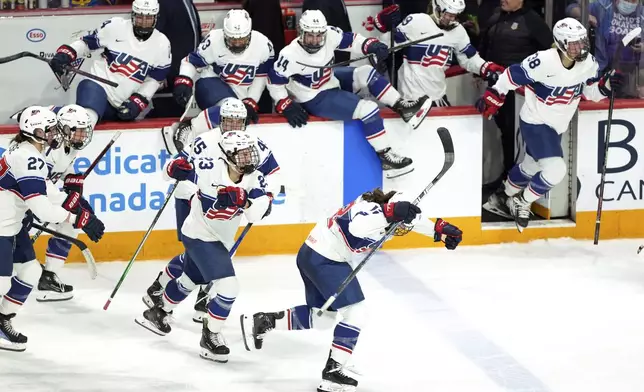 Members of USA celebrate a shootout win over Team Canada during the first period of a women's Rivalry Series hockey game in Halifax, Nova Scotia, Thursday, Feb. 6, 2025. (Darren Calabrese/The Canadian Press via AP)