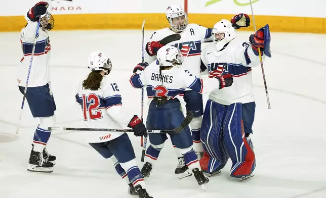 United States players celebrate after a shootout win over Team Canada in a women's Rivalry Series hockey game in Halifax, Nova Scotia, Thursday, Feb. 6, 2025. (Darren Calabrese/The Canadian Press via AP)