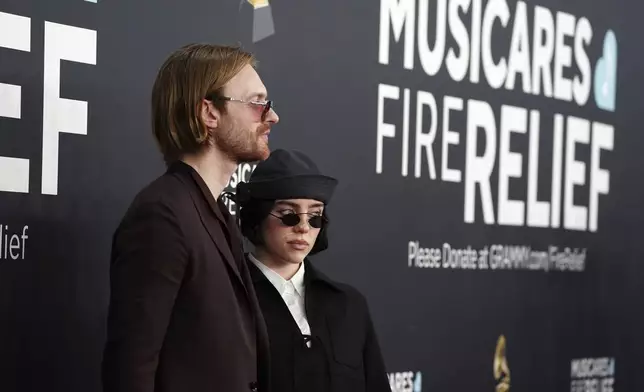 Finneas, left, and Billie Eilish arrive at the 67th annual Grammy Awards on Sunday, Feb. 2, 2025, in Los Angeles. (Photo by Jordan Strauss/Invision/AP)