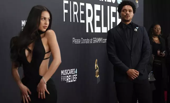Olivia Rodrigo, left, and Trevor Noah arrive at the 67th annual Grammy Awards on Sunday, Feb. 2, 2025, in Los Angeles. (Photo by Jordan Strauss/Invision/AP)