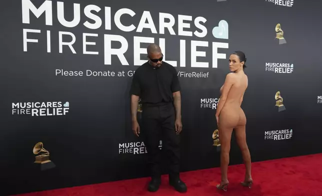Kanye West, left, and Bianca Censori arrive at the 67th annual Grammy Awards on Sunday, Feb. 2, 2025, in Los Angeles. (Photo by Jordan Strauss/Invision/AP)