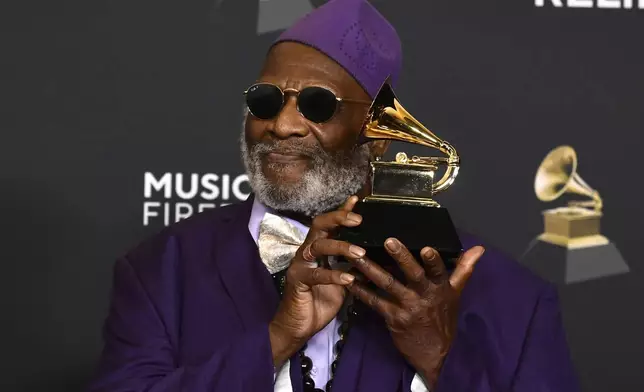 Lifetime Achievement Honoree musician Taj Mahal poses in the press room with the award for traditional blues album for "Swingin' Live at the church in Tulsa" during the 67th annual Grammy Awards on Sunday, Feb. 2, 2025, in Los Angeles. (Photo by Richard Shotwell/Invision/AP)
