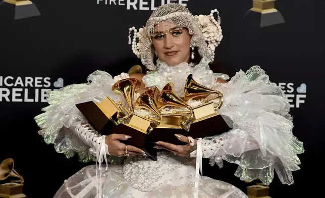 Sierra Ferrell poses in the press room with her awards for best American roots performance, best American roots song, best Americana performance and best Americana album during the 67th annual Grammy Awards on Sunday, Feb. 2, 2025, in Los Angeles. (Photo by Richard Shotwell/Invision/AP)