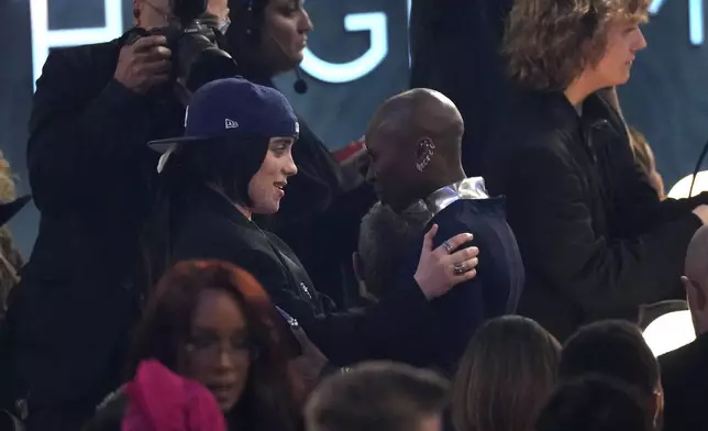 Billie Eilish, left, and Cynthia Erivo embrace in the audience during the 67th annual Grammy Awards on Sunday, Feb. 2, 2025, in Los Angeles. (AP Photo/Chris Pizzello)