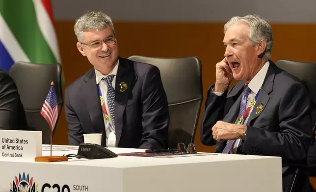 U.S. Federal Reserve Chair Jerome Powell, right, chats with a colleague at the G20 Finance Ministers and Central Bank Governors meeting in Cape Town, South Africa, Wednesday, Feb. 26, 2025. (AP Photo/Nardus Engelbrecht)