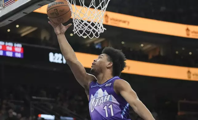 Utah Jazz guard Jaden Springer shoots a layup during the first half of an NBA basketball game against the Houston Rockets, Saturday, Feb. 22, 2025, in Salt Lake City. (AP Photo/Bethany Baker)