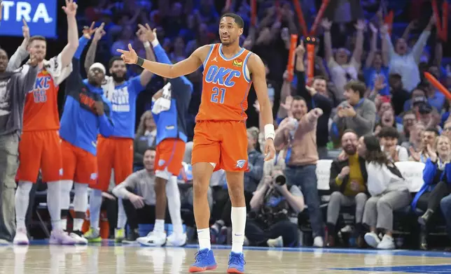 Oklahoma City Thunder guard Aaron Wiggins celebrates during the second half of an NBA basketball game against the Sacramento Kings, Saturday, Feb. 1, 2025, in Oklahoma City. (AP Photo/Kyle Phillips)