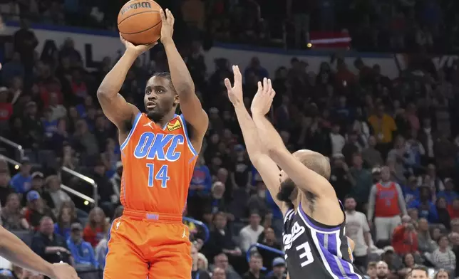 Oklahoma City Thunder forward Adam Flagler (14) shoots in front of Sacramneto Kings guard Jordan McLaughlin (3) during the second half of an NBA basketball game, Saturday, Feb. 1, 2025, in Oklahoma City. (AP Photo/Kyle Phillips)
