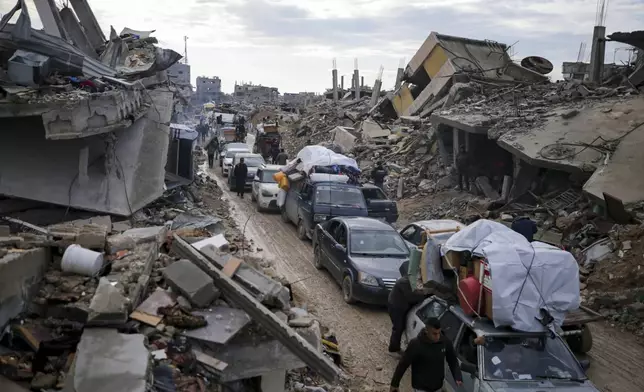 Displaced Palestinians make their way from central Gaza to their homes in the northern Gaza Strip, Monday, Feb. 10, 2025. (AP Photo/Jehad Alshrafi)