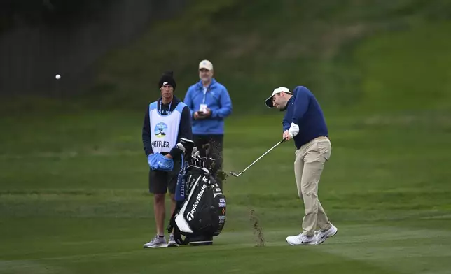 Scottie Scheffler hits from the fourth fairway at Pebble Beach Golf Links during the second round of the AT&amp;T Pebble Beach Pro-Am golf tournament, Friday, Jan. 31, 2025, in Pebble Beach, Calif. (AP Photo/Nic Coury)