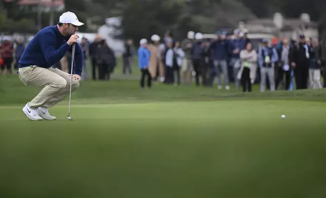 Scottie Scheffler lines up a putt on the sixth hole at Pebble Beach Golf Links during the second round of the AT&amp;T Pebble Beach Pro-Am golf tournament, Friday, Jan. 31, 2025, in Pebble Beach, Calif. (AP Photo/Nic Coury)
