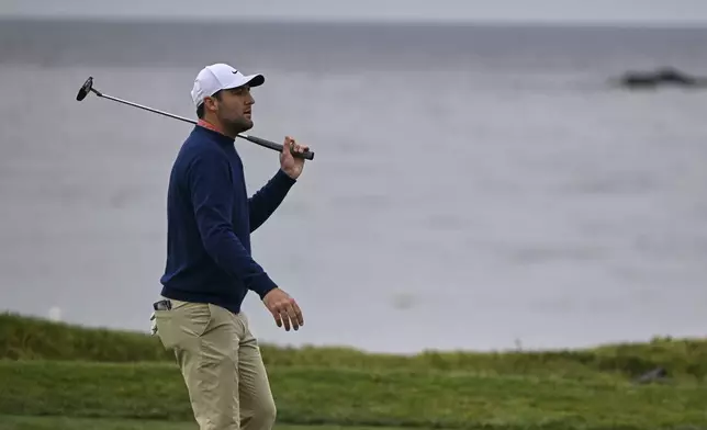 Scottie Scheffler reacts after missing a putt on the fourth hole at Pebble Beach Golf Links during the second round of the AT&amp;T Pebble Beach Pro-Am golf tournament, Friday, Jan. 31, 2025, in Pebble Beach, Calif. (AP Photo/Nic Coury)