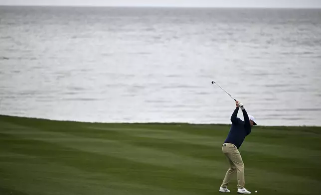 Scottie Scheffler hits from the sixth fairway at Pebble Beach Golf Links during the second round of the AT&amp;T Pebble Beach Pro-Am golf tournament, Friday, Jan. 31, 2025, in Pebble Beach, Calif. (AP Photo/Nic Coury)