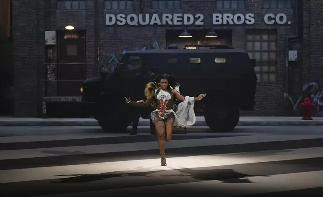 Doechii wears a creation as part of the Dsquared2 Fall/Winter 2025-2026 men's and women's collection presented in Milan, Italy, Tuesday, Feb. 25, 2025. (AP Photo/Antonio Calanni)