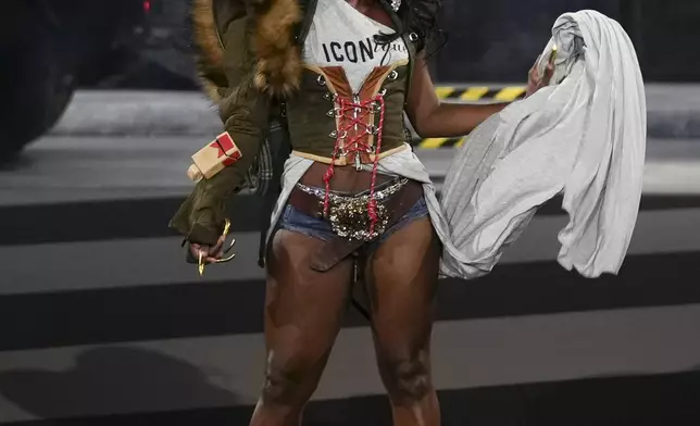 Doechii wears a creation as part of the Dsquared2 Fall/Winter 2025-2026 men's and women's collection presented in Milan, Italy, Tuesday, Feb. 25, 2025. (AP Photo/Antonio Calanni)