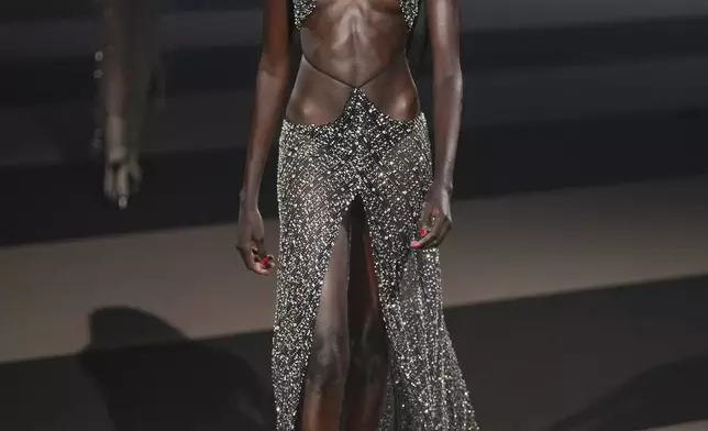 A model wears a creation as part of the Dsquared2 Fall/Winter 2025-2026 men's and women's collection presented in Milan, Italy, Tuesday, Feb. 25, 2025. (AP Photo/Antonio Calanni)