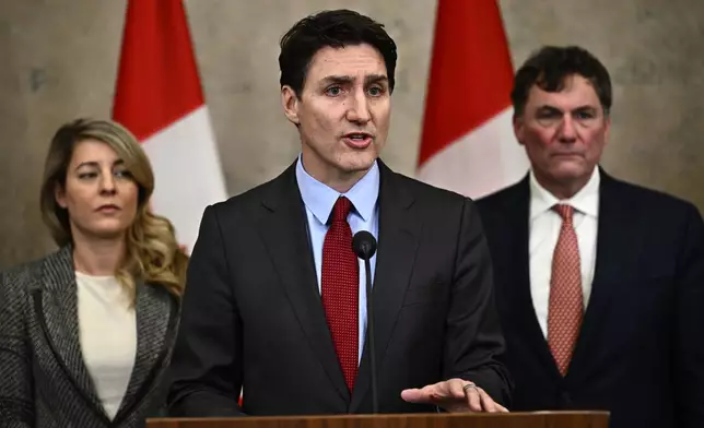 Canadian Prime Minister Justin Trudeau addresses media members after U.S. President Donald Trump signed an order to impose stiff tariffs on imports from Mexico, Canada and China, in Ottawa, Canada, Saturday, Feb. 1, 2025. (Justin Tang/The Canadian Press via AP)