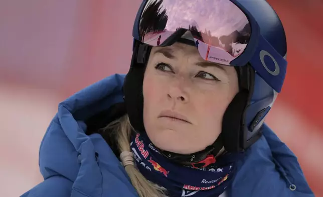 FILE - United States' Lindsey Vonn looks on ahead of an alpine ski, women's World Cup downhill training, in Garmisch-Partenkirchen, Germany, Friday, Jan. 24, 2025. (AP Photo/Giovanni Maria Pizzato, File)