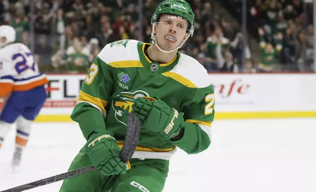 Minnesota Wild center Marco Rossi looks on after scoring a goal against the New York Islanders during the first period of an NHL hockey game Saturday, Feb. 8, 2025, in St. Paul, Minn. (AP Photo/Bailey Hillesheim)