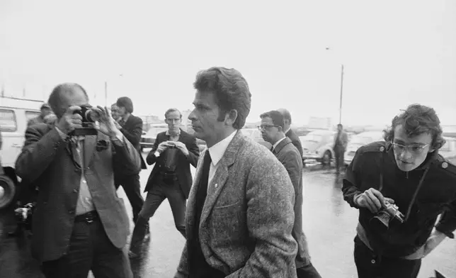 FILE - Russian world chess champion Boris Spassky, center, is followed by a member of the Soviet Delegation to the world chess championships in Reykjavik, Iceland on July 5, 1972, after they walked out of a meeting representatives of Bobby Fischer, Spassky's challenger from America. (AP Photo/File)