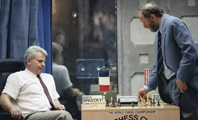 FILE - Boris Spassky, left and Bobby Fischer analyze their match in Sveti Stefan, Yugoslavia, Sunday, Sept. 20, 1992. (AP Photo/Milos Vukadiovic, File)